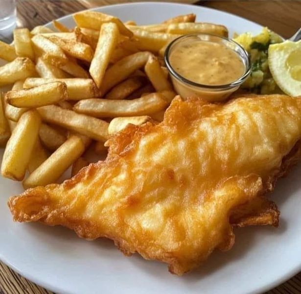 fish and fries are served on a white plate