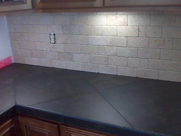 a kitchen counter top that has been painted black