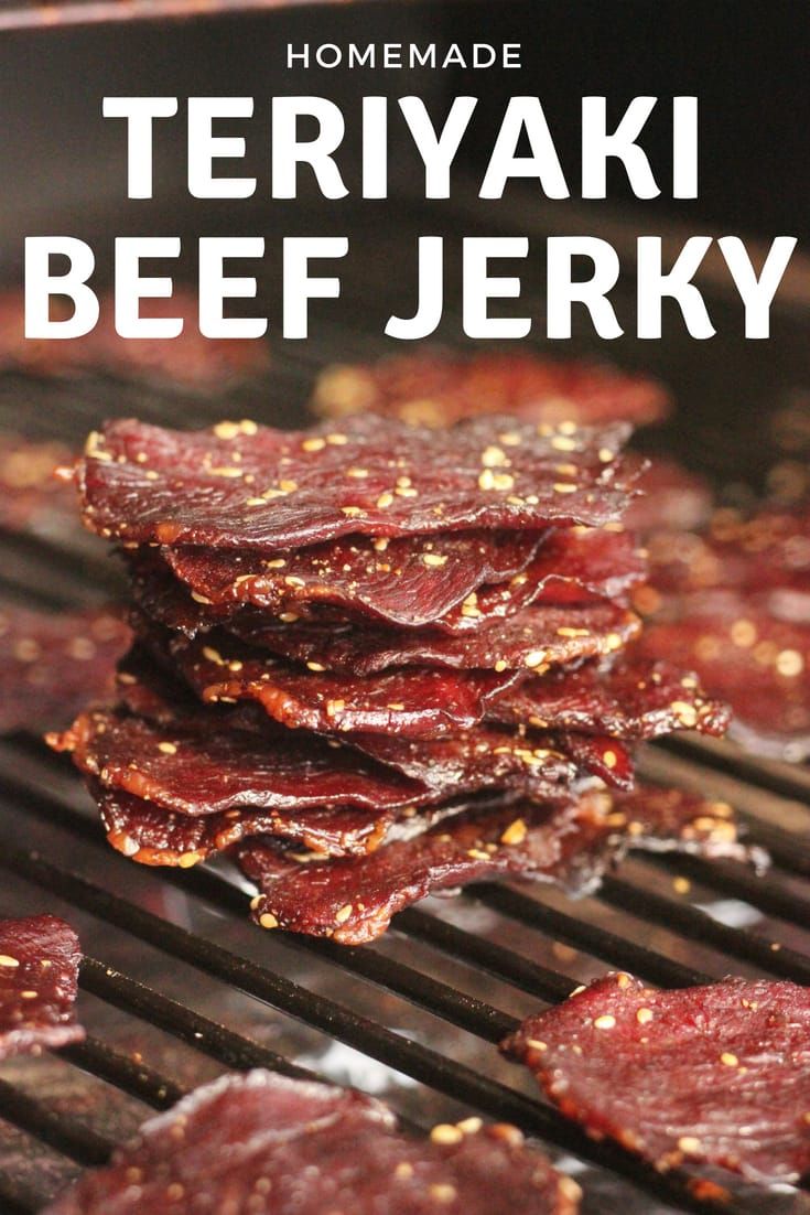 some food is cooking on a grill with the words homemade teriyaki beef jerry