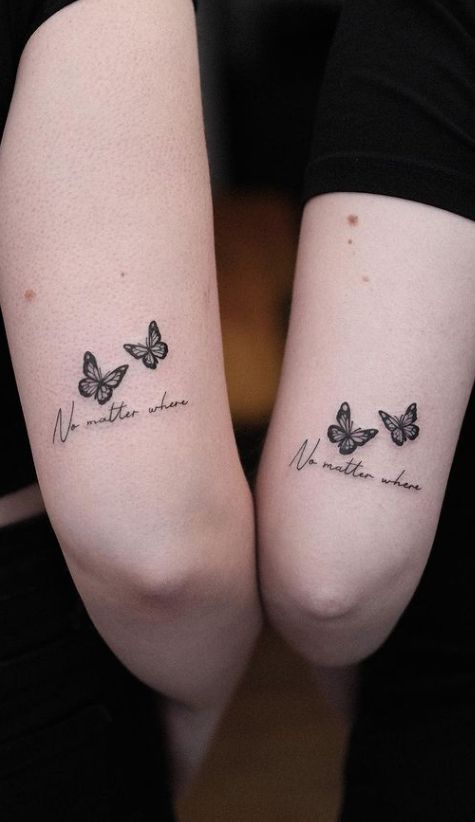 two girls with matching butterfly tattoos on their arms