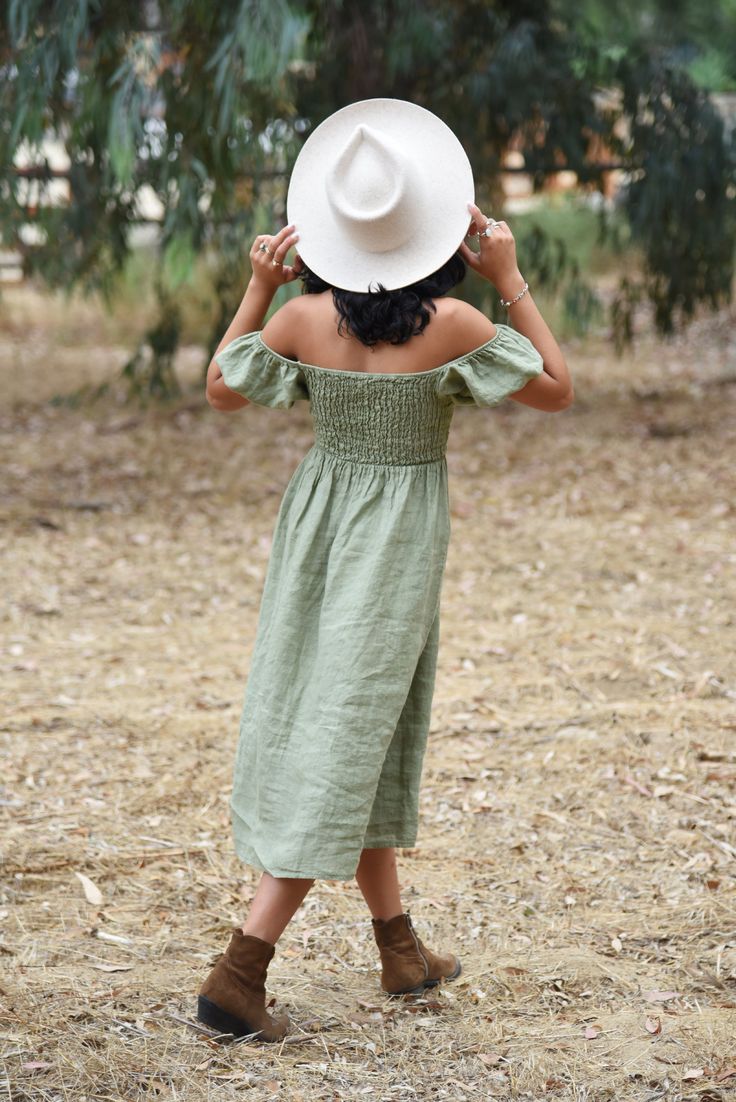 Style // Our newest shade of the perfect green. Sage is a light and fresh color and perfect for any occasion. Effortlessly romantic and oh so pretty. Designed to transition throughout the year. Pair with sandals for summer or boots for fall and winter, the Menorca Dress is a timeless piece to take you from season to season. Made from super-soft linen, with puffed sleeves that can be worn the way you love best! Fit Note: Available in two sizes, this dress features an elastic fitted bodice, ideal Green Linen Dress, Summer Aesthetics, Dress Sage, Boots For Fall, Green Sage, Fresh Color, Timeless Dress, Menorca, European Summer