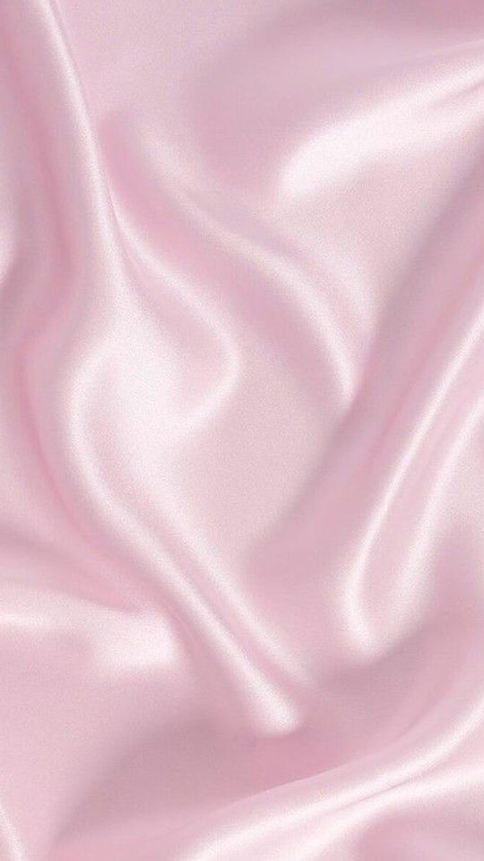 a close up view of a pink satin fabric