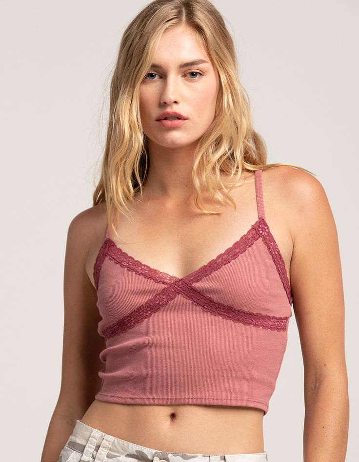 Rsq Lace Trim Cami. V-Neck. Rib Knit Construction. Lace Trim On Neckline And Underbust. Adjustable Spaghetti Straps. Cropped Fit. 48% Cotton, 47% Polyester, 5% Spandex. Machine Wash. Imported. Model Is Wearing A Size Small. Model Measurements:height: 5'8" Bust: 32"waist: 24"hips: 34" Summer V-neck Crop Top For Layering, Trendy V-neck Seamless Camisole, Trendy Seamless V-neck Camisole, Trendy V-neck Bra Friendly Tops, Feminine Seamless V-neck Camisole, Casual Seamless V-neck Camisole, Casual V-neck Camisole, Bra Friendly, Trendy V-neck Top Bra Friendly, Trendy V-neck Top, Bra Friendly