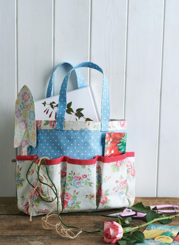 a bag is sitting on a table next to some scissors and other crafting supplies