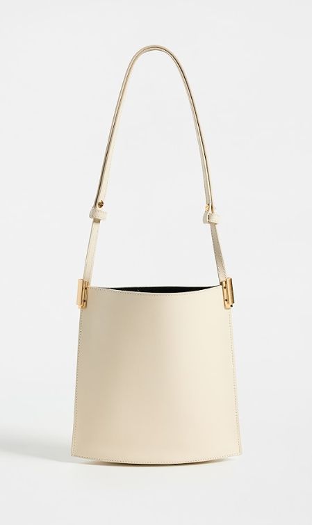 Find NEOUS Dorado 1.0 Shoulder Bag on Editorialist. Calfskin,Gold-tone hardware,Open top,Patch interior pocket,Suede lining,Weight: 10oz / 0.28kg,Made in Italy Gold Calf Leather Shoulder Bag With Brass Hardware, High-end Beige Shoulder Bag With Gold-tone Hardware, High-end Everyday Leather Bucket Bag, Gold Leather Bucket Bag For Formal Occasions, Gold Leather Bucket Bag For Formal Events, Gold Calf Leather Bag With Gold-tone Hardware, Modern Gold Shoulder Bag With Metal Hardware, Designer Gold Bucket Shoulder Bag, Formal Gold Leather Bucket Bag