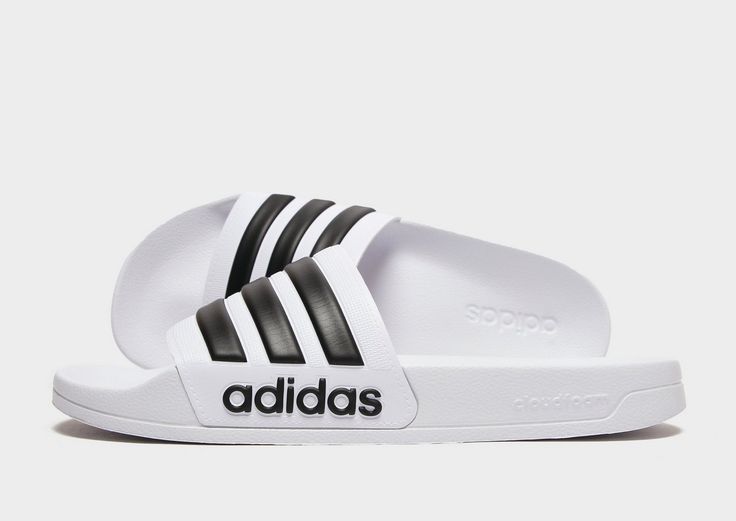 On off-duty days, rep these men's Adilette Slides from adidas. Coming in a white and black colourway, these slides have sit on a lightweight, contoured footbed with plush Cloudfoam cushioning for next-level comfort. They have a soft top strap for a secure feel, with an easy slip-on design, and a durable rubber outsole for essential traction. Finished up with the iconic 3-Stripes across the foot strap, and an adidas wordmark at the midsole.|GZ5921 Jd Sports, Soft Tops, White Adidas, Adidas Originals, Slides, White And Black, Slip On, Adidas, Shower