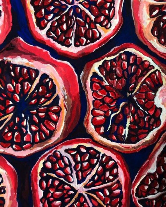 a painting of pomegranates cut in half