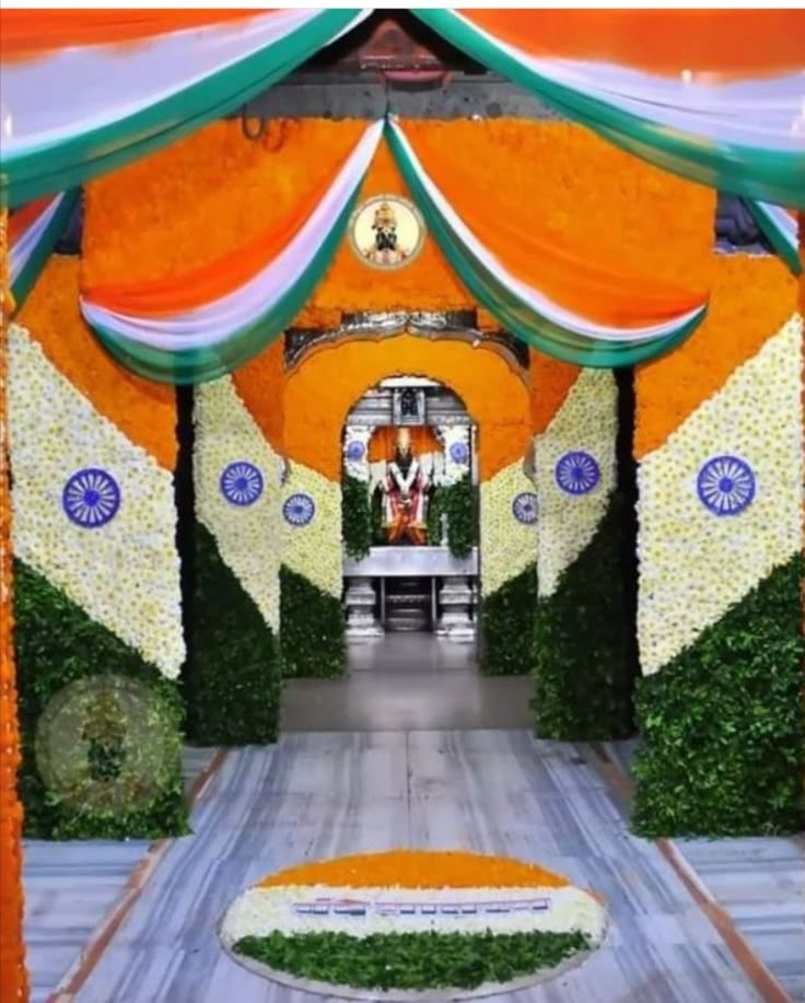 an orange and white tent with flowers on it