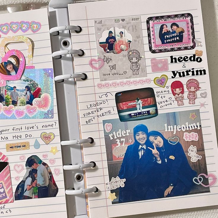 two notebooks with pictures and stickers on them