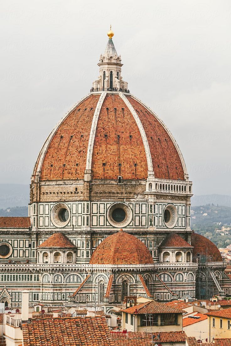 the dome of an old building is shown in this view from across the city's rooftops