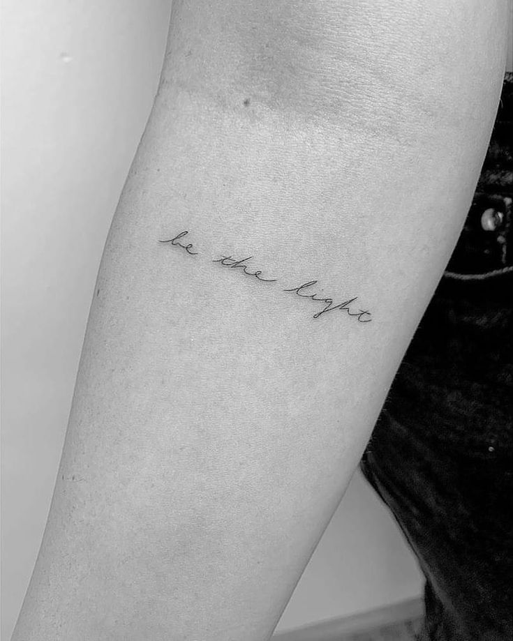 a woman's arm with the words i love you in cursive writing