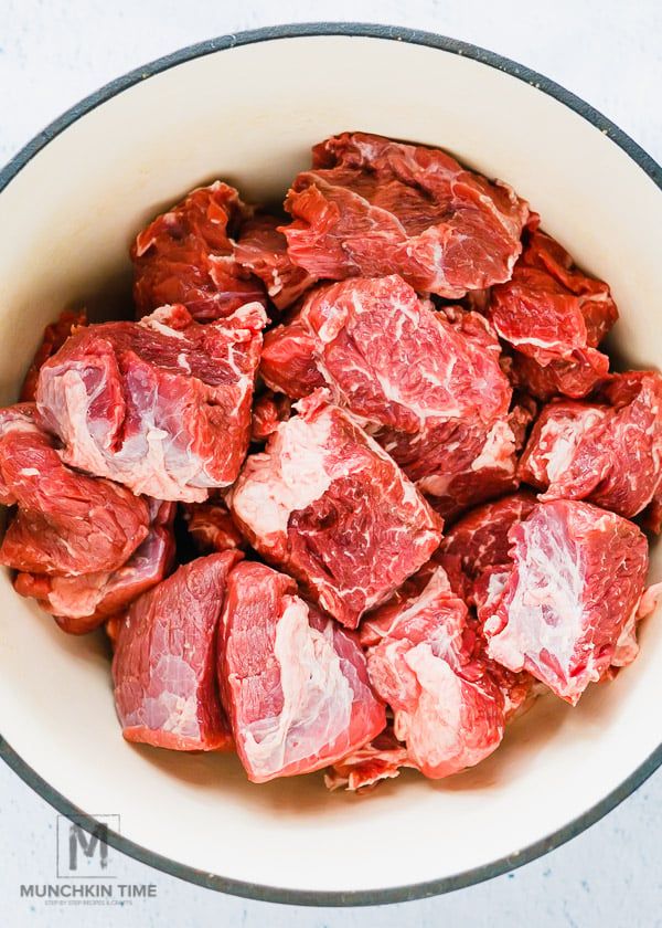 raw meat in a white bowl on a table