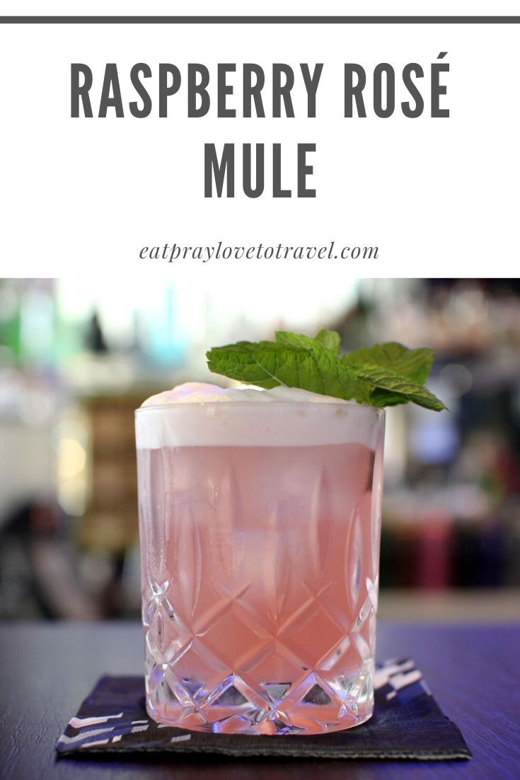 raspberry rose mule on a table with text overlay that says raspberry rose mule