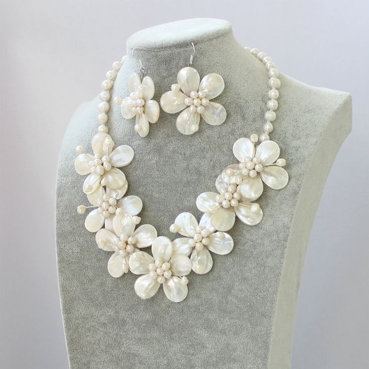 "Material:Natural white shell, Natural freshwater pearll,Cowhide rope, lobster clasp Bead size: 6-7-8mm, 13*18mm,15*20mm Necklace size: 18\" + 2\" extension chain Color: White Packing: Beautiful Pouch All items in my shop are made to order. . Most of the time it takes 1-3 business days but can be longer at times and for larger orders. If you want to order of different style. Please contact me . ----------------------------------------------------- Please feel free to convo me should you have any Flower Statement Necklace, Pearl Necklace Earrings, Best Friend Necklaces, Daughter Necklace, Birthday Gifts For Girlfriend, Necklace Pearl, Bff Gifts, Pearl Shell, Wedding Jewelry Sets