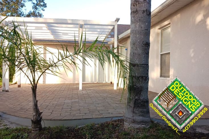 a palm tree in front of a house