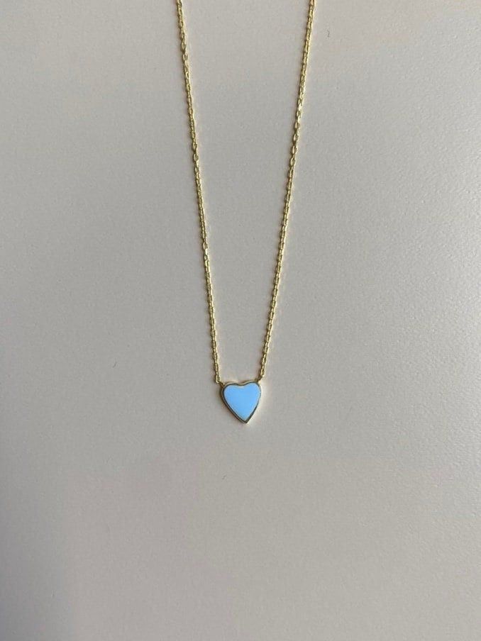 This heart necklace is so dainty and gorgeous, perfect for everyday wear! Information: 💙 The necklace is made of Sterling Silver, plated with 14K Gold. 💙 The blue color in the heart is made of enamel. 💙 The chain is a cable chain, adjustable to a total of 18 inches. 💙 Hypoallergenic 💙 Water friendly This necklace makes the perfect choice for layering or for that special person in your life! Blue Dainty Necklace With Heart Charm, Dainty Blue Necklace With Heart Charm, Dainty Blue Heart-shaped Necklace, Blue Dainty Jewelry For Valentine's Day, Dainty Blue Necklace For Valentine's Day, Blue Heart-cut Necklaces With Heart Charm, Blue Heart Cut Necklaces With Heart Charm, Blue Heart-shaped Clavicle Chain Necklace, Blue Heart Shaped Clavicle Chain Necklace