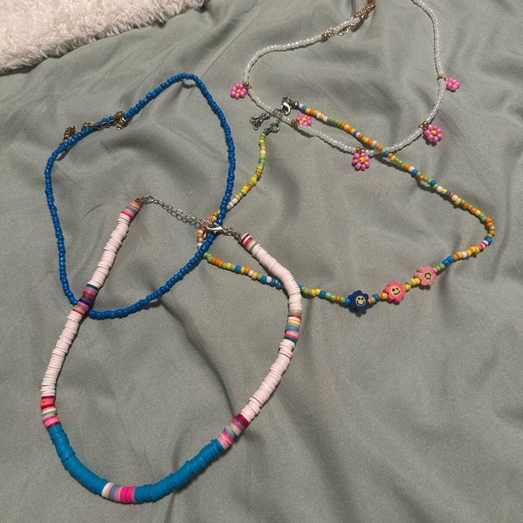 Perfect For The Summer I Believe I Only Have Worn The Rainbow Smily Face One A Few Times .. The Rest Are Unworn I Can’t Remember Where I Got Them All From But The Rainbow Smiley Is From Altrd State Blue Beaded Necklaces With Colorful Beads For Spring, Colorful Blue Beaded Necklaces For Spring, Trendy Blue Beaded Necklaces For Festival, Trendy Blue Beaded Necklaces For Summer, Cute Blue Necklaces For Summer, Pink Beaded Necklace For Spring Beach Occasion, Pink Beaded Necklace For Beach In Spring, Casual Pink Beaded Necklaces For Spring, Pink Beaded Necklace For Beach And Spring