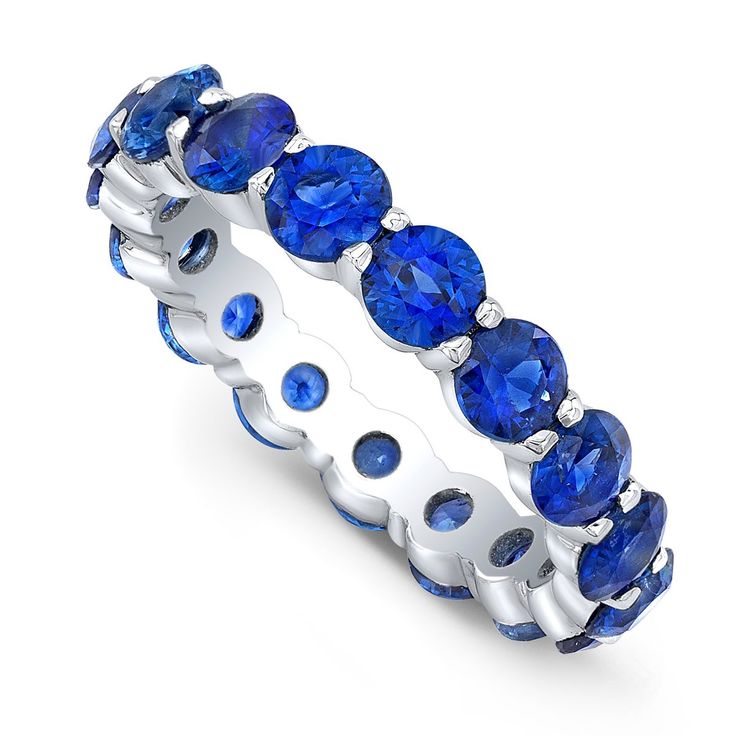 a white gold ring with blue sapphire stones