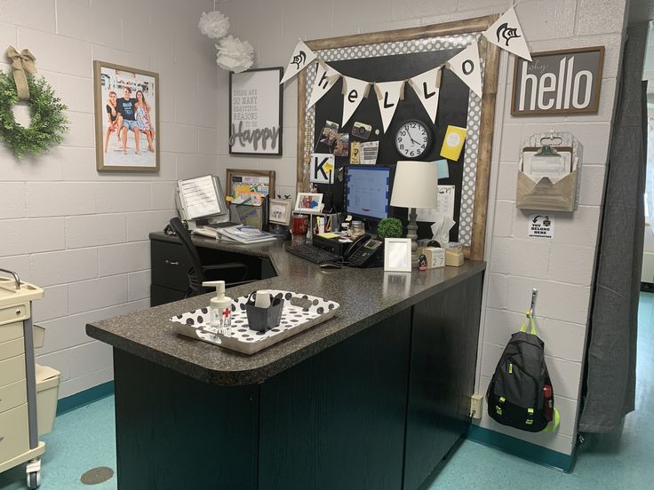 an office cubicle is decorated with black and white decorations