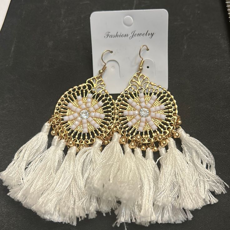 Earrings With White Tassels And Gold Tone With White And Clear Stones All $5 Items Are Now On Sale 3/$10 Elegant White Tassel Earrings For Pierced Ears, Nickel Free White Drop Earrings, Nickel-free White Drop Earrings, Elegant White Summer Earrings, White Dangle Tassel Earrings For Party, White Tassel Earrings For Pierced Ears Party, Bohemian White Tassel Earrings For Pierced Ears, White Dangle Tassel Earrings As Gift, White Tassel Dangle Earrings