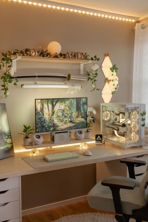 a computer desk topped with a monitor and keyboard next to a window filled with plants