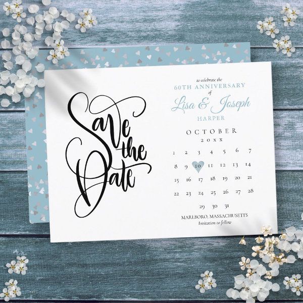 save the date card with white flowers and blue background