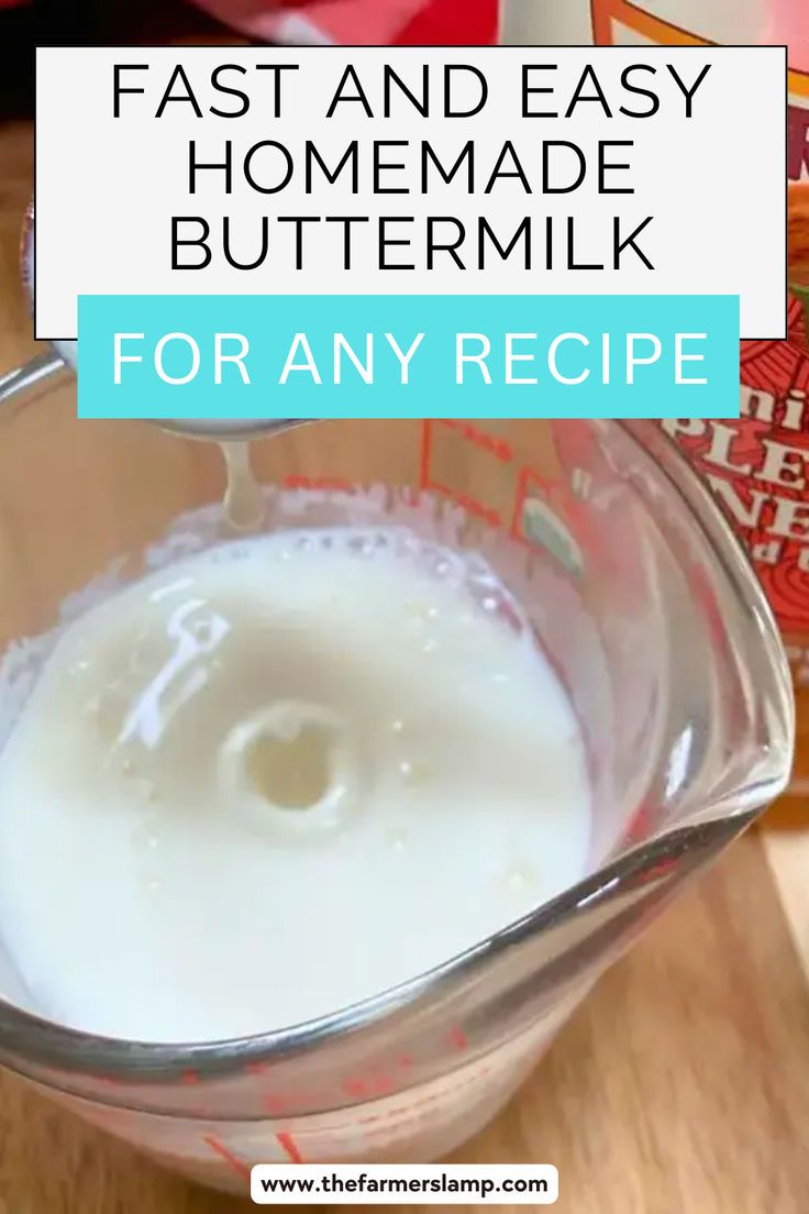 a glass bowl filled with milk and yogurt on top of a wooden table