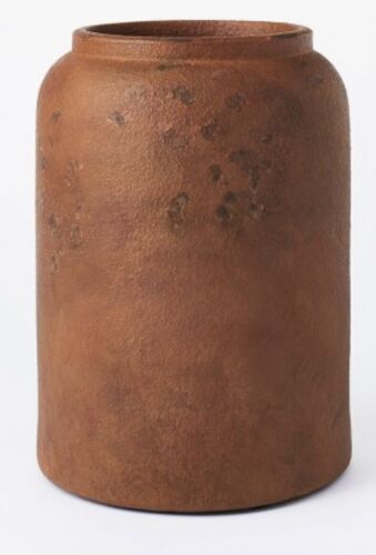 an old brown vase is shown against a white background