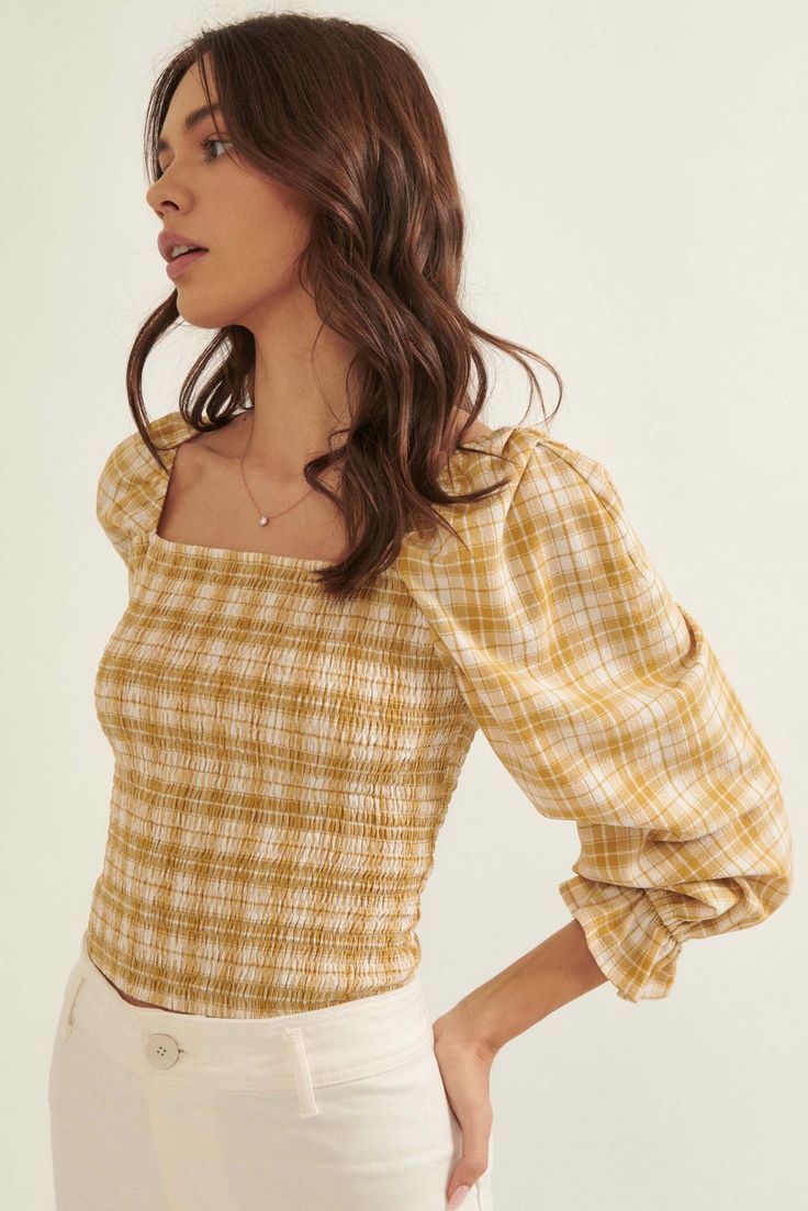 Plaid-print blouse. Square neckline. Smocked bodice. Long puff sleeves with ruffle cuffs. Low square back. Cropped length. Fitted silhouette. 87% Polyester, 10% Rayon, 3% Spandex. Imported. Designed in LA. Model wears size S. Barn Dance, Smock Blouse, Plaid Blouse, Stylish Blouse, Polka Dot Blouse, Fashion Studio, Peasant Tops, Long Puff Sleeves, Work Tops