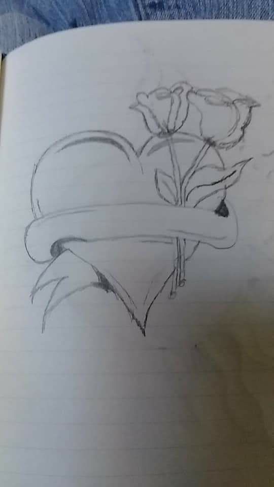 a drawing of a heart with flowers on it