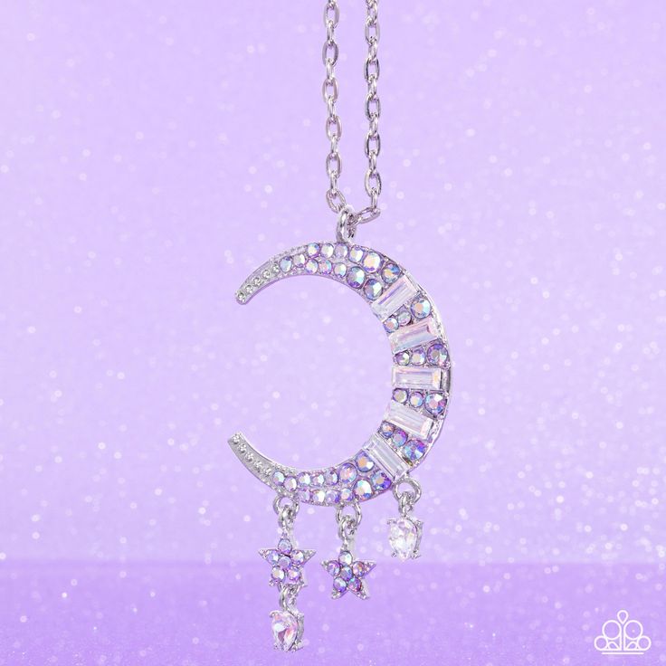 Featuring purple iridescent rhinestones and emerald-cut iridescent gems, a silver moon charm twinkles from an extended silver chain. Two dainty silver stars and marquise-cut gems dangle along the crescent moon charm for additional celestial detail. Features an adjustable clasp closure. Due to its prismatic palette, color may vary.

 Sold as one individual necklace. Includes one pair of matching earrings. Celestial Necklace, Purple Jewelry, Kids Bracelets, Palette Color, Purple Necklace, Paparazzi Accessories, Silver Moon, Moon Charm, Spring Trends