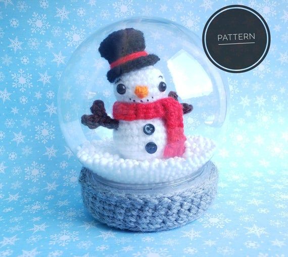 there is a snow globe with a snowman inside