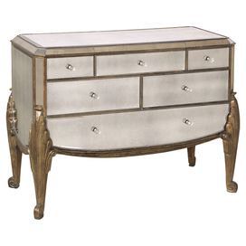 an antique dresser with mirrored drawers and gold trimmings on the top, against a white background