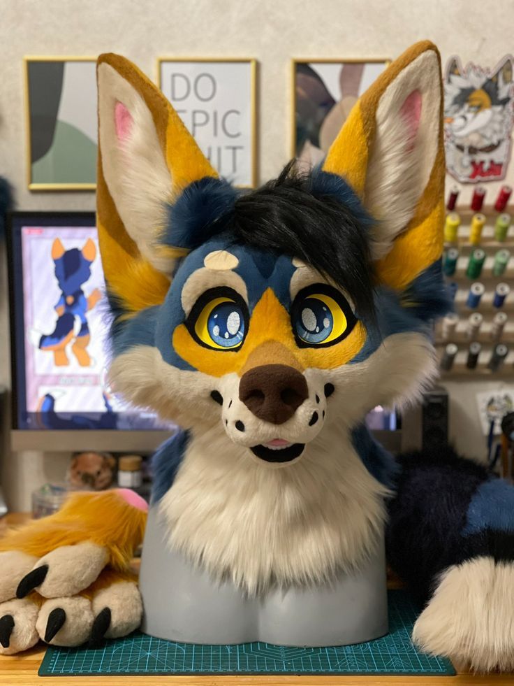 a stuffed animal sitting on top of a desk