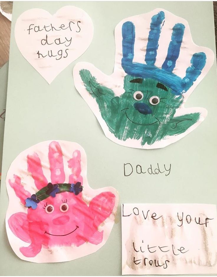 two handprints with different designs on them, one for father's day and the other for dad's day