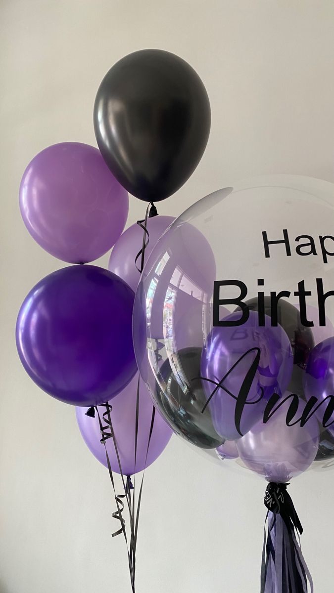 a bunch of balloons with the words happy birthday agnes written on them in black and purple