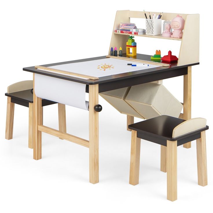 a child's table and chair set with an easel