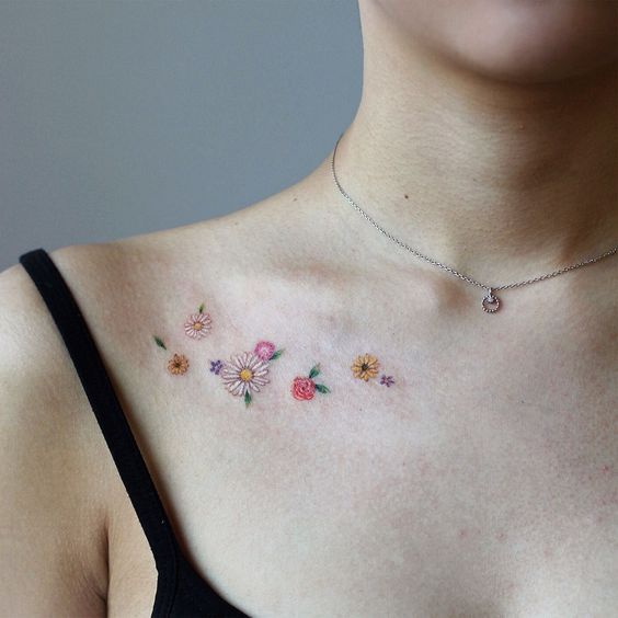 a woman's chest with flowers on it