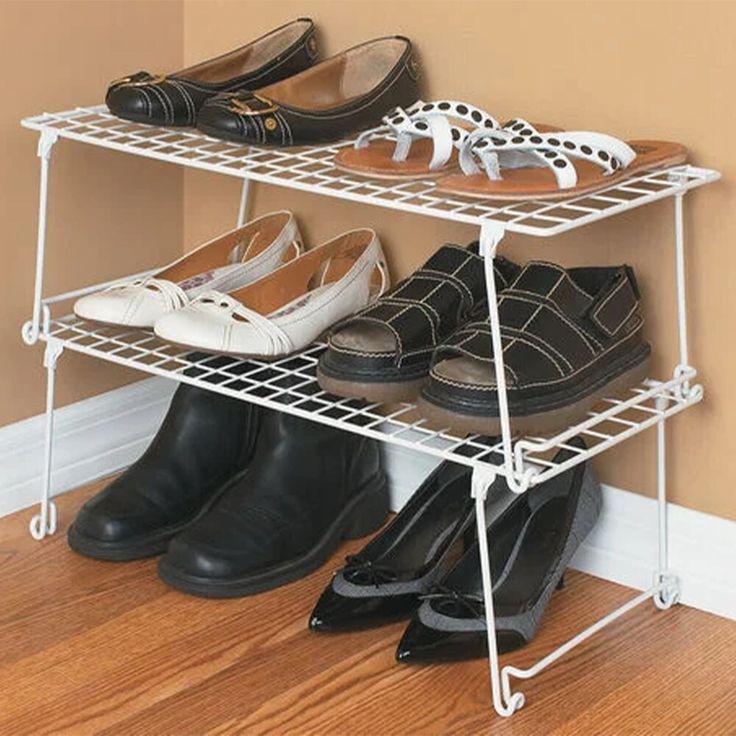 three tiered shoe rack with shoes on it