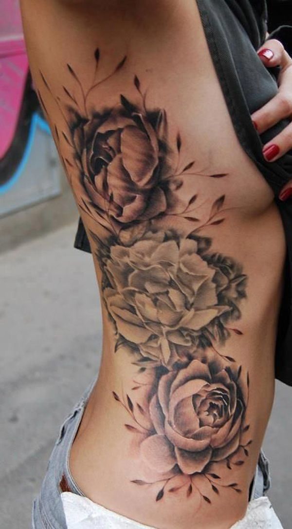 a woman's stomach with flowers on it