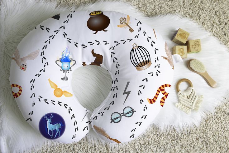 a white neck pillow with various items on it