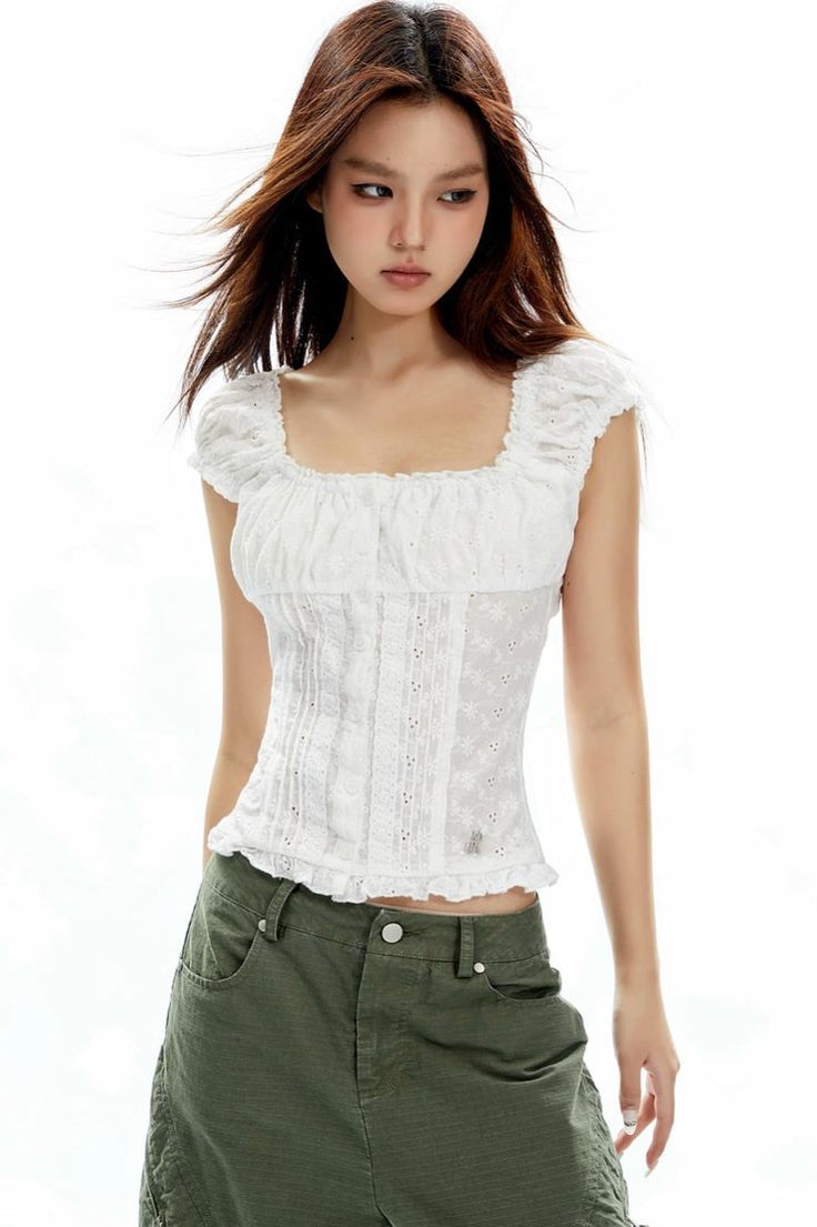 Capture an effortless vibe with our Ruffled Square Neck Lace Crop Top, where romance meets casual chic. This top showcases exquisite lace detailing and an appealing square neckline, complemented by charming ruffled edges. Crafted entirely from pure, breathable cotton, it's as comfortable as it is stylish. Its slim-fit design flatters the silhouette, while the lightweight nature ensures ease of wear for any occasion. Whether paired with your favorite high-waisted jeans for a casual outing, or wit Feminine Tops With Lace Trim And Ruffled Straps, Spring Square Neck Tops With Lace Trim, Feminine Blouse With Lace Trim And Square Neck, Spring Square Neck Top With Lace Trim, Feminine Square Neck Blouse With Lace Trim, Feminine Square Neck Top With Lace Trim, White Square Neck Blouse With Lace Trim, White Blouse With Lace Trim And Square Neck, Spring Fitted Lace Top With Ruffles