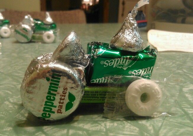 two rolls of toilet paper and some candy on a table