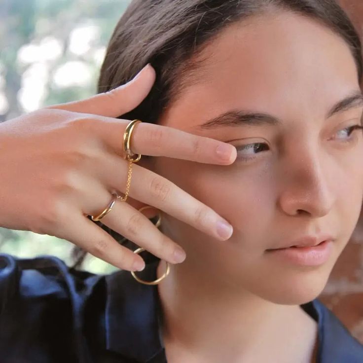 Sizes 5/7, 7/8, and 6/8 are out of stock. Gold vermeil and sterling silver ring set with chain. Innovative, edgy, & feminine. Elevate any outfit with this modern take on the chain ring.From day to night, wear this set three ways - let the chain drape for an editorial look or wrap it and stack it to create the illusion of a third band. Can't decide between silver & gold? Simply rotate to style a new way every day.Rings are sized for ring and pointer fingers ie. 6 for ring, 7 for pointer = 6/7 Tarnish Resistant Metal Open Ring Jewelry, Gold Chain Jewelry With Open Ring Design, Modern Sterling Silver Rings With Adjustable Chain, Gold Jewelry With Chain Detail In Open Ring Shape, Metal Jewelry With Adjustable Chain And Open Ring Shape, Sterling Silver Jewelry With Chain And Open Ring Shape, Gold Sterling Silver Chain Ring, Sterling Silver Open Ring Chain Jewelry, Sterling Silver Chain Ring In Gold Color