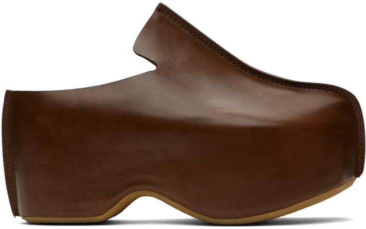 JW Anderson: Brown Leather Platform Clogs | SSENSE Brown Leather Mules With Sculpted Heel, Modern Brown Leather Clogs, Brown Almond Toe Mules With Sculpted Heel, Modern Brown Mules With Almond Toe, Leather Loafers With Sculpted Heel, Leather Slip-on Loafers With Sculpted Heel, Leather Clogs With Sculpted Heel And Almond Toe, Leather Almond Toe Clogs With Sculpted Heel, Brown Calf Leather Closed Toe Mules