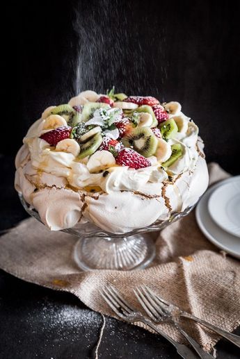 a dessert with fruit and whipped cream on top