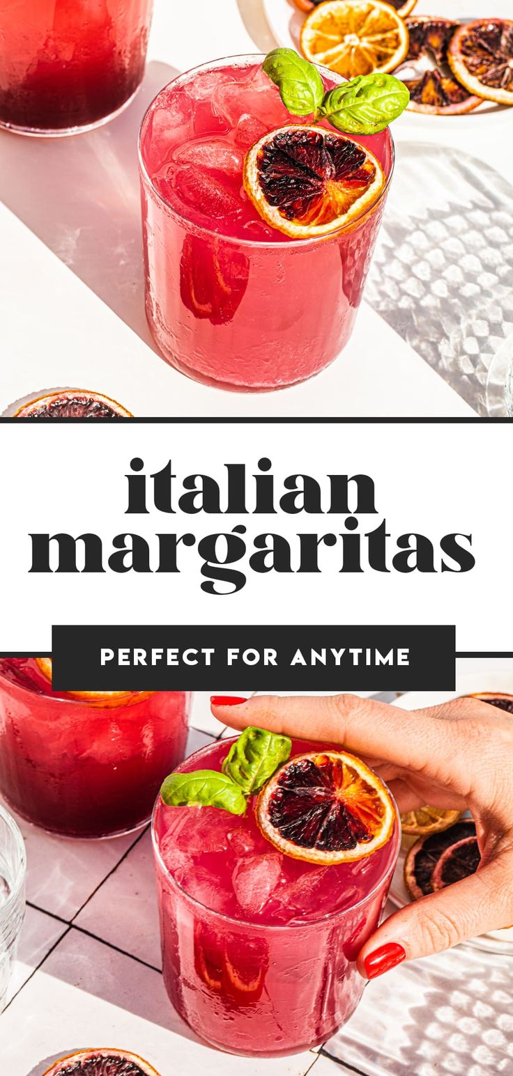 two glasses filled with blood orange margaritas and garnished with basil