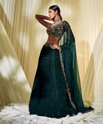 Bottle Green Lehenga Set - DISHA MUCHHALA - 4008113 Bottle Green Indian Outfit, Indian Designer Blouses, Dark Green Lehenga Designs, Trending Lehenga Designs 2023, Bottle Green Suits Women Indian, Lehenga Designs Green, Dark Lehenga, Green Lehenga Designs, Formal Lehenga