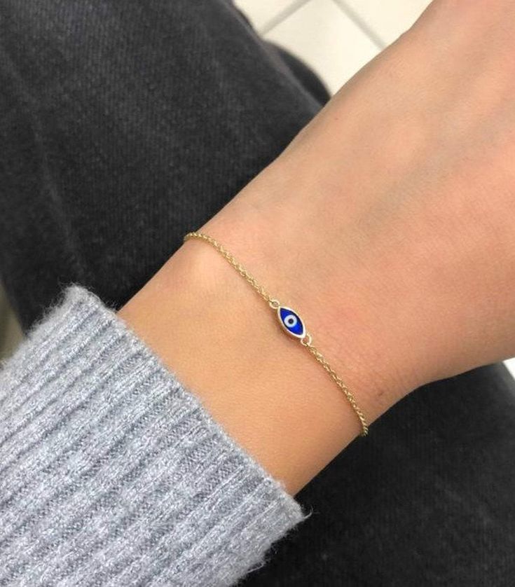 14K SOLID YELLOW GOLD DARK BLUE EVIL EYE BRACELET Here is a dainty, delicate and simple, yet classy minimalist evil eye bracelet . This is 14k Solid Yellow Gold. (We do not sell filled or plated jewelry) Perfect for everyday use.Absolutely stunning. Comes in a gift box. PRODUCT DETAILS Material: 14k Solid GoldBracelet Length: 7.25 inches / 18cmEvil Eye Dimension: 8.5mm length - 3.5mm width --Shipping Policy-- Item will be shipped within 1-3 business days of receiving full payment. Evil Bracelet, Star Wedding Band, Blue Evil Eye Bracelet, Gold Evil Eye Bracelet, Gold Diamond Heart Necklace, Classy Minimalist, Butterfly Necklace Gold, Solid Gold Bracelet, Ruby Bracelet