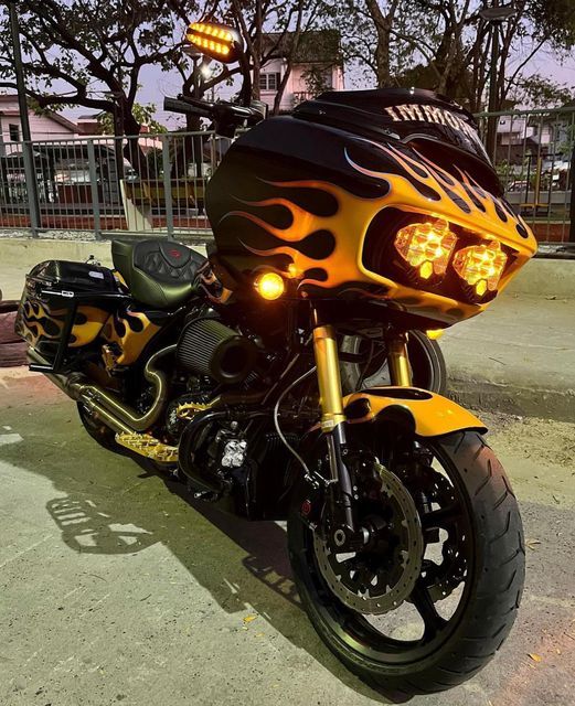 a yellow and black motorcycle with flames on it